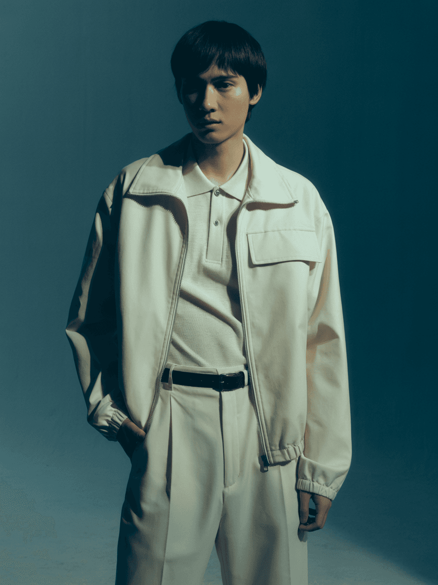 Cream-Colored Zip-Up Jacket Styled With A Matching Polo Shirt And Belted Tailored Trousers